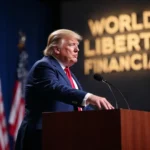 Trump speaking at a podium with a World Liberty Financial logo behind him