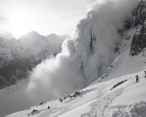 A gigantic avalanche barreling down a snow-covered mountainside